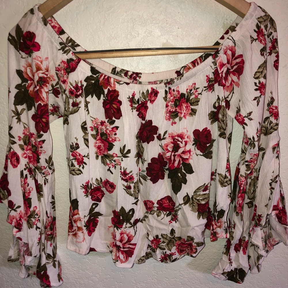 White top with red flowers